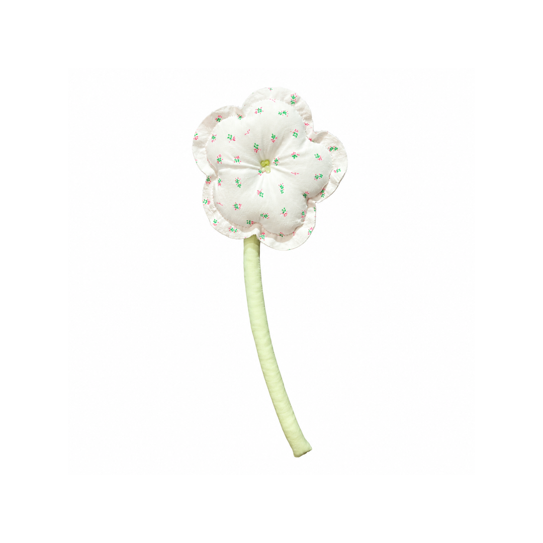 Handmade pink ditsy bloom fabric flower stem on white background