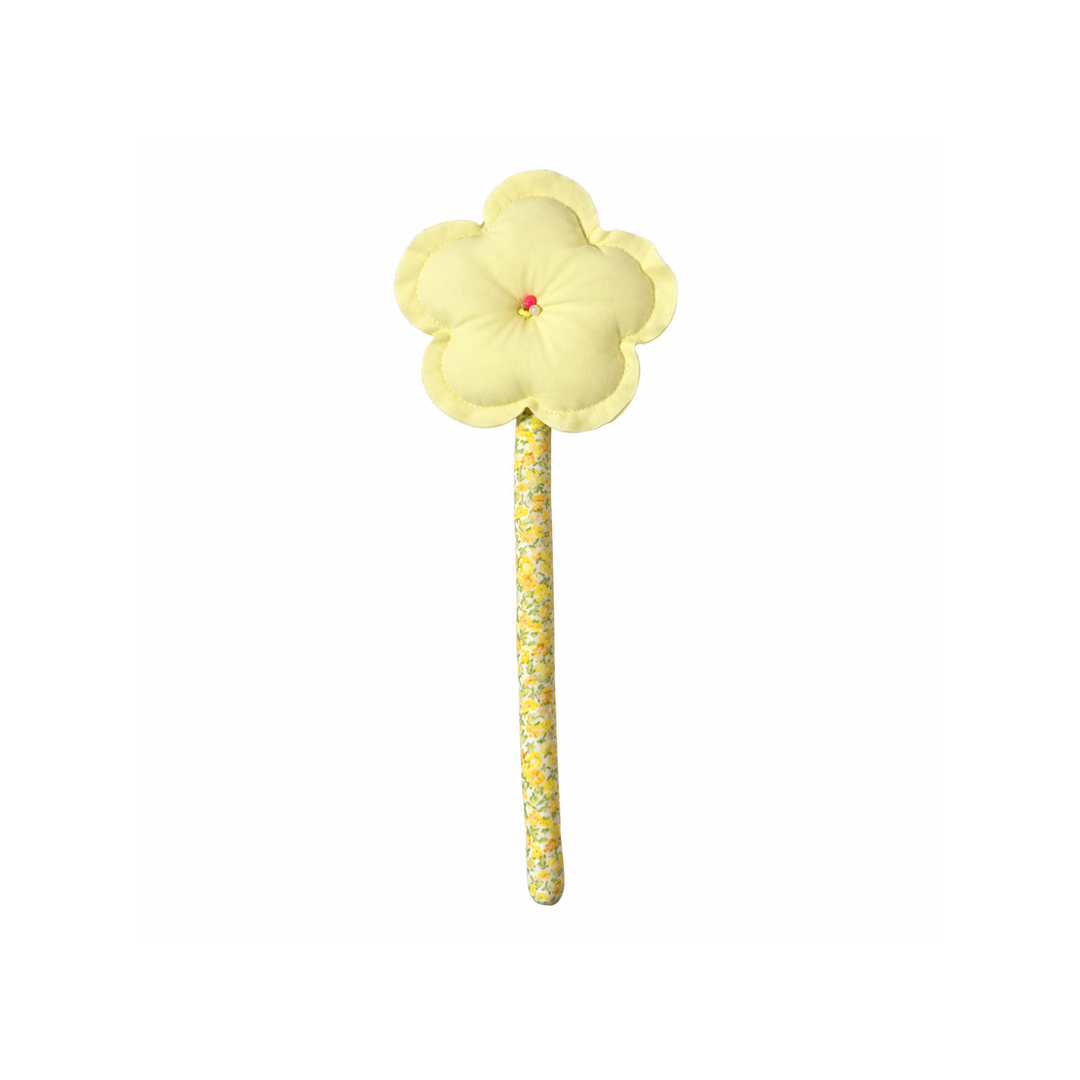 Handmade butter yellow bloom fabric flower stem on white background