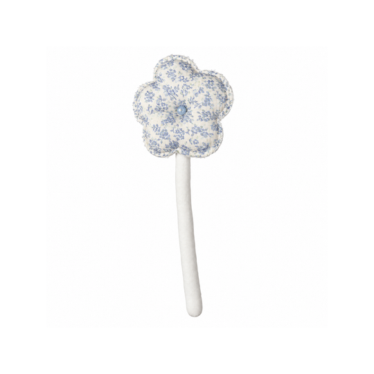 Handmade blue ditsy bloom fabric flower stem on white background