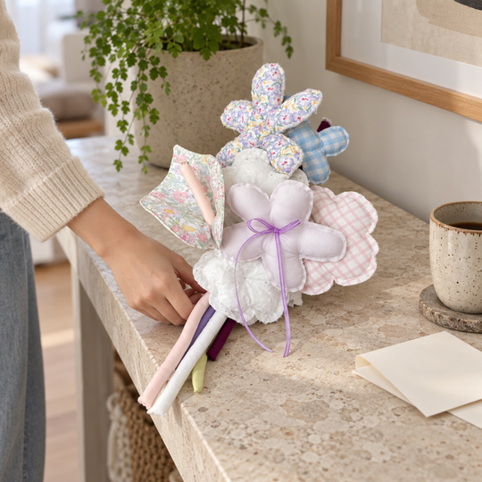 Pastel handmade fabric bouquet resting on a console in a bright modern home