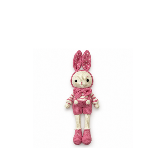 Pink crochet bunny, full front view on a white background