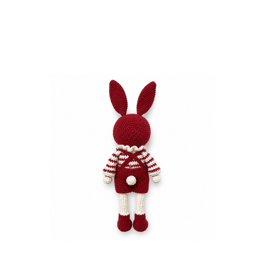 Red crochet bunny, full back view on a white background