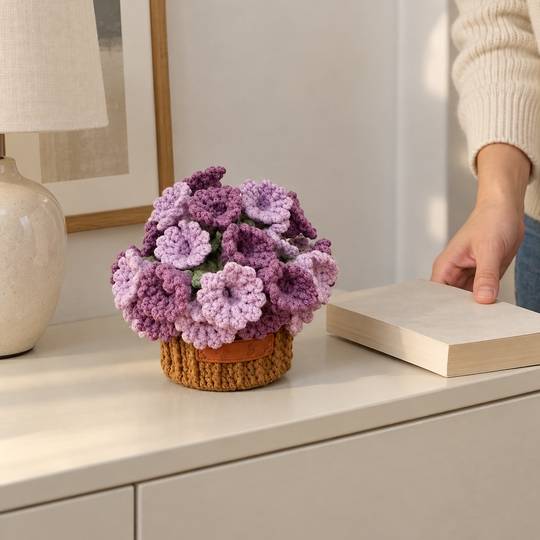 Purple flower coasters folded into a brown pot in a home setting
